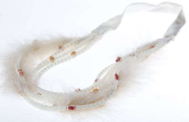 Surrey 3d printed textile neckpiece Surrey 3d printed textile neckpiece with feather and hand finished elements